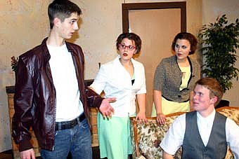 Noah Nelsen-Gross,  left, who plays Joe Lanconi, son of Luigi Lanconi, makes a point to Travis Jorde (Mr. Morlock) as Audra Mulleneaux (Mary Morlock), center, and Catherine Mulleneaux (Mrs. Morlock) look on during a dress rehearsal for the Stewartville High School production of "Rest Assured," which will be held at the SHS Performing Arts Center this Friday. 