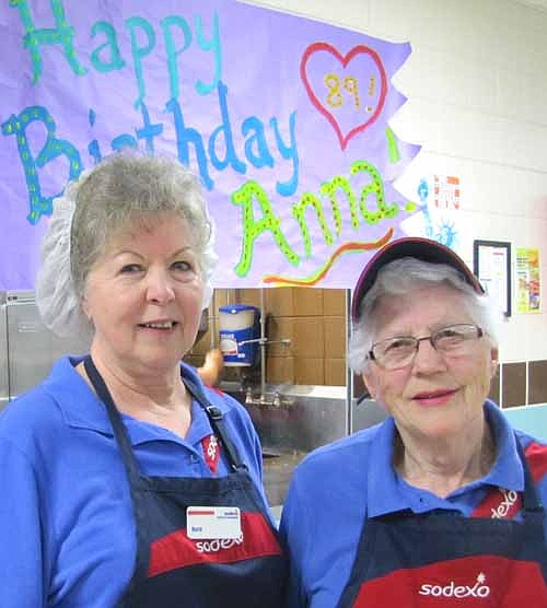 Anna Bussman, right, has worked for Sodexo, the company that provides meals for Stewartville's students, for about four years. Students at Stewartville High School sang "Happy Birthday" to Bussman as she entered the High School-Middle School cafeteria last Tuesday, April 14. Barb Edwards, Bussman's co-worker, is at left. 