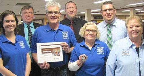Members of the Stewartville Kiwanis Club accepted Tiger Tokens at the Stewartville School Board's regular meeting last week. Club members include, front row, from left, Laura Wiles, Todd Weston, Jan Hagen and Iz Wilken. Administrators who presented the Tokens include, back row, from left, Dr. David Thompson, Tim Malone and Steve Gibbs. The Kiwanis Club helps Stewartville students in many ways, Gibbs said. 