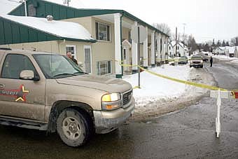INVESTIGATION -- Olmsted County Sheriff's Office deputies investigating a suspicious death at an apartment at 104 Second Avenue Southwest cordoned off the area with tape on Monday morning, Jan. 28. 