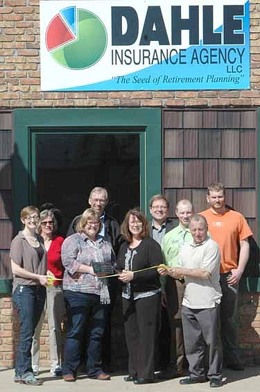 The Stewartville Area Chamber of Commerce welcomed the Dahle Insurance Agency to the local business community with an official ambassador visit last week. From left are Melissa Sue Leuning, Chamber president; Pat Dahl, Gwen Ravenhorst, Chamber administrator; John Senjem, Bridget Dahle (cutting ribbon), Joel Thiem, Andy Mai, Mayor Jimmie-John King and Ryan Ravenhorst.