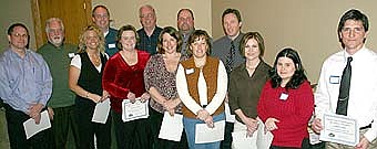A number of Stewartville Area Chamber of Commerce members received certificates of appreciation for serving on committees during 2007. Those members include, from left, Mark Rusciano, Gene Peters, Beth Schmidt, Greg Schimek, Stephanie Fossum, Mike Wiginton, Dr. Stephanie Lillis, Paul Skifton, Judy Schroeder, Troy Peterson, Chris Dahle, Stacy Savoy, Jarett Jones. 