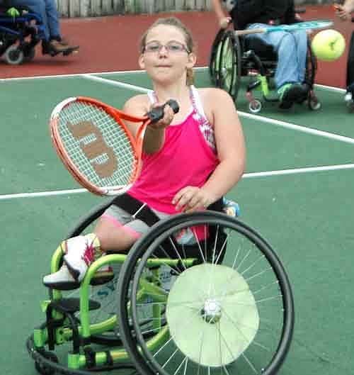 Lilly Stiernagle of Easton, Minn. returns a forehand at the National Wheelchair Sports Camp last week.