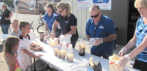 All-American Co-op provided free root beer floats to guests who stopped by Tuesdays off Main on Tuesday, June 23. Servers included Beth Pagel of All-American Co-op, Mayor Jimmie-John King and Ann Lutteke of Bremer Bank.