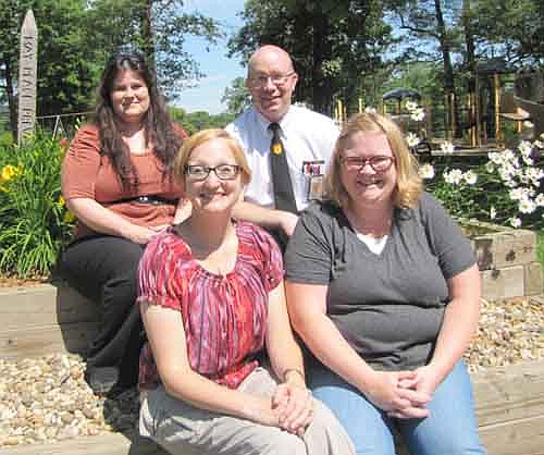 The Stewartville Area Chamber of Commerce will present its annual Fourth of July Summerfest celebration at Florence Park on Friday, July 3 and Saturday, July 4. A few of the many individuals planning the event include, front row, from left, Melissa Sue Leuning, Chamber president and chair of the Summerfest Parade;  and Gwen Ravenhorst, Chamber administrator. Back row, from left, Stacy Hanson, chair of the Street Dance; and Robert Hruska, chair of Arts in the Park.