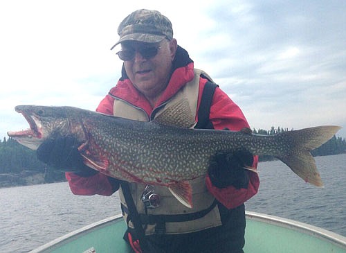 "A pair of Genes," Gene Gustason and Gene Bernard enjoyed a Canadian fishing trip in early June, when Gene Bernard reeled in this 15.5-pound Lake Trout.