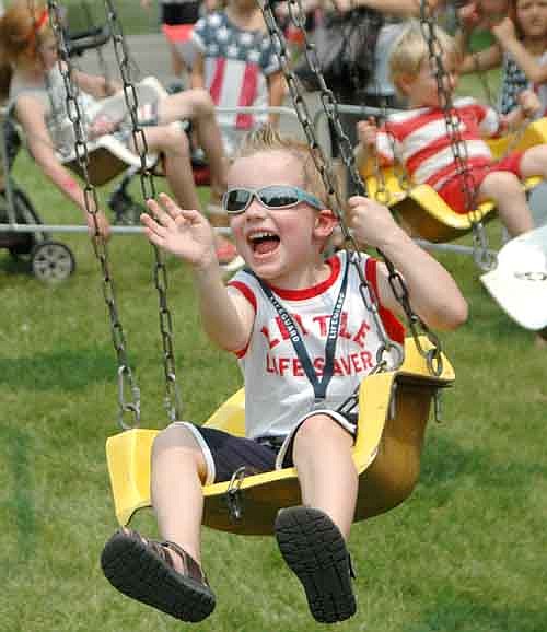 Rylan Clapp, 4, greets his grandmother with a wave and a smile as he enjoys the swing ride at the Stewartville Area Chamber of Commerce's Summerfest celebration on Saturday, July 4. See more Summerfest photos on Page 5.