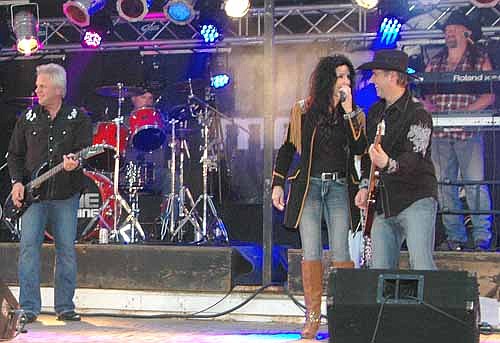 Time Machine, known as a 1980s hair band, played pop, country and disco favorites for a large audience at the Summerfest Street Dance on Friday evening, July 3. Time Machine has now played at Summerfest for five consecutive years.