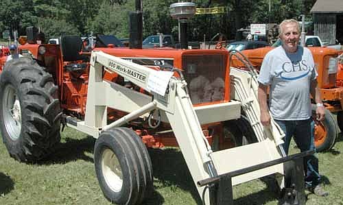 Brian Johnson of Grand Meadow, above, and his son Matt grow corn, soybeans and hay and care for about 190 head of cattle on a farm west of Racine. Johnson brought two Allis-Chalmers machines to this year's Root River Antique Historical Power Association, Inc., Show, including a 1976 175 Diesel, above.