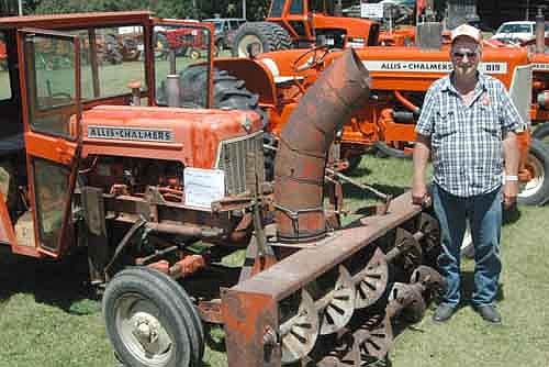 Allis-Chalmers tractors and equipment were the featured machines at the Root River Antique Historical Association Antique Engine and Tractor Show south of Racine last Friday, Saturday and Sunday. Lyle Julson, who grew up on a farm about 2 1/2 miles west of Grand Meadow, brought two Allis-Chalmers machines to the show, including a 1960 D-15 on which is mounted a snow blower.