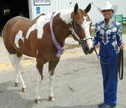 Shanalyn Bird, 19, celebrated her retirement from the Olmsted County Fair by winning the reserve championship in showmanship with her horse, Freckles. "He's just a good horse," Bird said. "We make a good team."