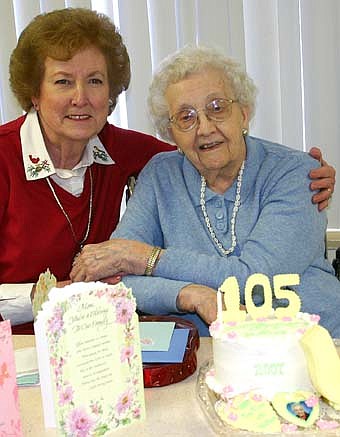Ruth and Margaret Lex pose near Lex's "tea time" birthday cake. 