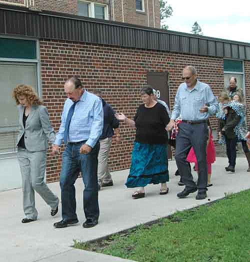 Pastor Rick Scott and his wife Peggy, lead the members of the Stewartville Assembly of God Church in a prayer walk near Central Intermediate School on Sunday, Aug. 23.