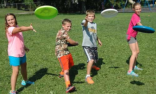 Students in Ryan Liffrig's physical education classes at Central Intermediate School are taking part in a Frisbee unit, which includes Frisbee bowling and Frisbee football. Fifth graders demonstrating their throwing form include, from left, Ava Johnson, Dylan Smith, Mason Ristau and Keeley Steele.