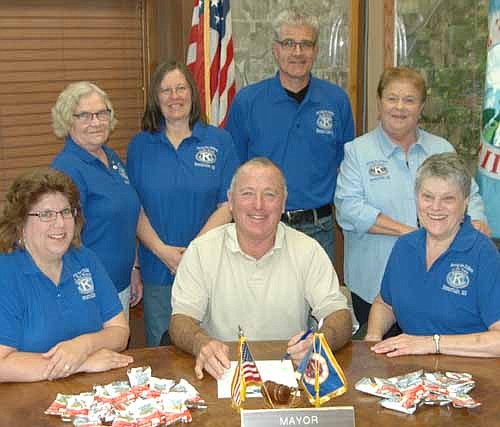 Mayor Jimmie-John King, seated front and center, signed a proclamation last week declaring Saturday, Sept. 12 "Peanut Day" in the city of Stewartville. On that day, members of the Stewartville Kiwanis Club will be stationed at Fareway and Casey's to collect money that will be donated to the Eliminate Project, a team effort by Kiwanis International and UNICEF to rid the world of maternal and neonatal tetanus. Local Kiwanis Club members working on the project include, from left, Lori Torgerson, Janice Hagen, Barb Howes, Todd Weston, Iz Wilken and Mary Brouillard.