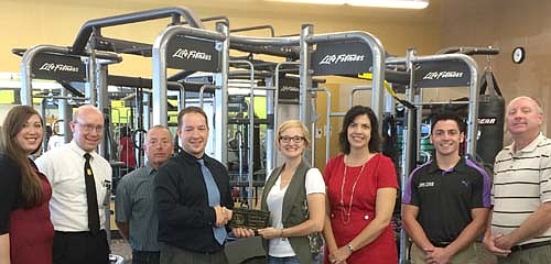 The Stewartville Area Chamber of Commerce welcomed ActivePT to the local business community with an official ambassador visit last week. Jake Hoeppner of ActivePT, fourth from left, accepts a Chamber plaque from Melissa Sue Leuning, Chamber president. Other Chamber members include, from left, Joya Stetson, Robert Hruska, Mayor Jimmie-John King, Margaret Nelson, Jameson Hanson and Bill Schimmel Jr., city administrator.