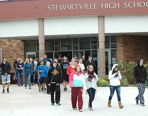 Students and teachers evacuated Stewartville High School and Middle School and walked to Grisim School Bus, Inc. during a fire drill on Wednesday morning, Oct. 14. Zak Breitenbach, Stewartville's community oriented policing (COPS) deputy, said the drill went well. "It was an orderly evacuation and was done in a timely fashion," he said. "The purpose...was to gauge our preparedness to handle an evacuation to Grisim and to account for all the students once there."