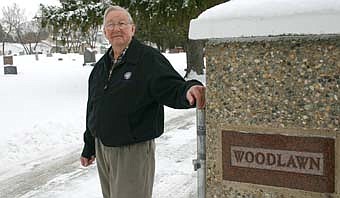 CARETAKER -- George Reinhart, 89, is retiring from his work as superintendent, president or director of the Woodlawn Cemetery Board. He has cared for the cemetery in a number of capacities for about 41 years. 