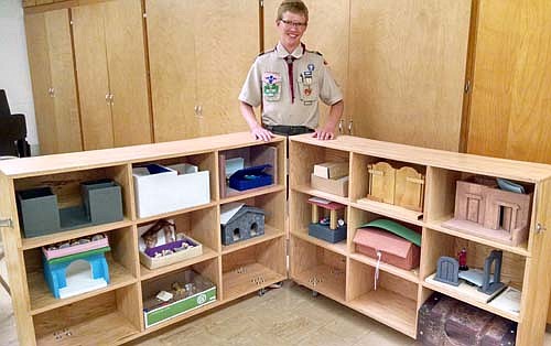 For his Eagle Scout project, Jacob built a mobile/portable cabinet for the Catechesis of the Good Shepherd program at St. Bernard's Catholic Church. He and other Scouts put in 102 hours to complete the work.