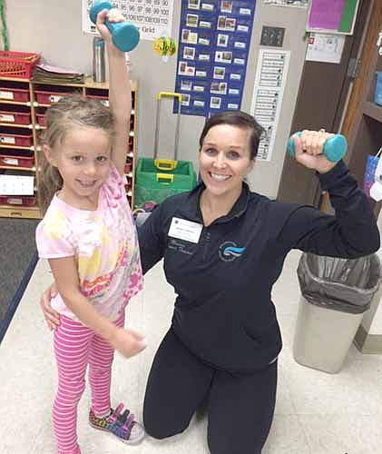 Monica Hansen, a fitness trainer for the Rochester Athletic Club (RAC), talked about her profession with the kindergartners at Bonner Elementary School at the annual Kindergarten Career Day on Tuesday, Oct. 13. Kayla Hansen, Monica's daughter, is at left.