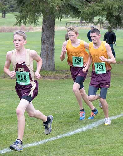 Dylan Bauman (#420) and Dylan Deetz (#423) gain ground on a Pine Island runner at sections.