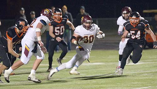 Running back Jordan Johnson cuts back for a big ground gainer during Stewie's 35-7 state quarterfinal win over Marshall on Oct. 30.