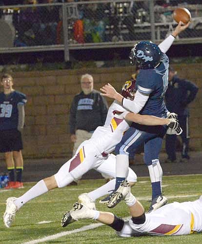 D-end Chance Jakobsen drills the Becker quarterback as he releases the ball.