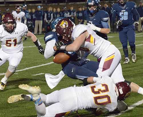 Garret Nosbisch  hits high and Jordan Johnson (#30) low, forcing a fumble for Dawson Grotjohn (#51) to recover.