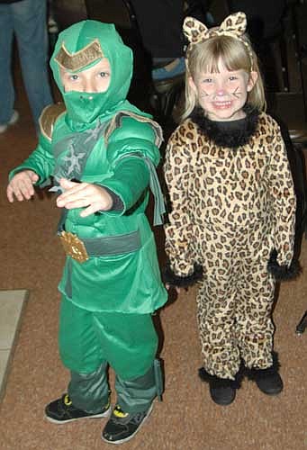 Hunter Hysell, 6, left, and his sister Makayla, 4, of Grand Meadow, are all decked out in their costumes at the Kids Halloween Party at the Stewartville American Legion on Saturday, Oct. 31.