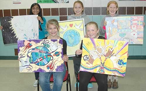 Stewartville Middle School sixth graders who were the top placewinners in the annual Lions Club Peace Poster Contest include, front row, from left, Aryana Baerthel, first place; and Jaida Emmons, second place. Back row, from left, Anushka Mishra, honorable mention; Lauren Buckmeier, third place; and Mesa Wibben, honorable mention. Aryana will move on to district competition, where she will compete against students from across southeastern Minnesota. Gordy Koehn of the Stewartville Lions Club, speaking at an assembly at Stewartville Middle School last week, encouraged the sixth graders to promote peace in their own lives. He reminded the students of the song, Let there be Peace on Earth, and Let it Begin with Me.