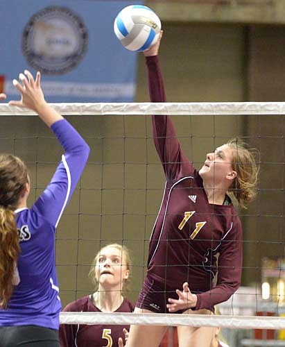 Libby Christenson blasts a kill during Stewie's section championship win over Red Wing.