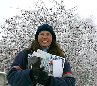 Wendy Reck, a Stewartville mail carrier, walked in a winter wonderland last Thursday, Feb. 7, when many of the city's trees were covered by thick coatings of frost. 