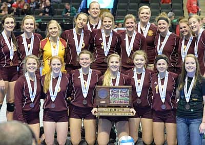 After receiving bronze medals, the Stewartville volleyball team poses with the 2015 MSHSL Class AA Volleyball State tournament third-place championship trophy. Tiger team members are, kneeling, from left, Carissa Smith, Emily Rinken, Julianne Waugh, Angela Patterson, Laura Eberle, Kailee Brower, student manager Mack VanDeWalker. Standing, from left, Tara Rogers, Karissa Kime, Emily Branstad, Kaitlyn Prondzinski, Coach Scott Willenborg, Kaitlyn Augustin, Libby Christenson, Coach Traci Fransen, Jenna O'Connell, Charlie Bleifus, Jenna Willenborg.