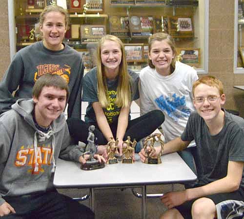The Stewartville cross country runners recently honored are, in front, Isaiah Scruggs (left) and Christopher Remling. In back, from left, Chrissy Lofgren, Kailee Malone and Abby Orvis. See related story at right.