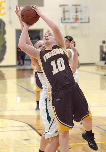 Kara O'Byrne breaks baseline to beat a Lancer defender for this leaning lay-in.