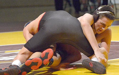 Tiger 170-pounder Shawn Curtis turns and attempts to wiggle free for a reversal.