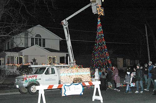 The city of Stewartville, which featured a lighted Christmas tree with a star on top, won the award for the best float in the stand-still Winterfest Parade.