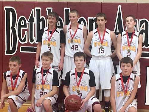 The Stewartville Youth Basketball Association 7th grade boys basketball team captured first place at the Faribault BA 8th grade tournament, beating the Byron 8th grade team 56-22 in the championship game. Team members are, kneeling, from left, Nolan Stier, Bryce Rindels, Ben Trenary, Kaleb Hellickson. Standing, from left, Josh Buri, Trent Einertson, Parker Theobald, Lane Sexton.