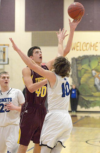 Carter Groski uses his height advantage to beat a KoMet defender with this turn-around hook shot.