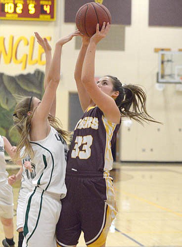 Hunter Miller breaks baseline,  stops and pops a quick jumper.
