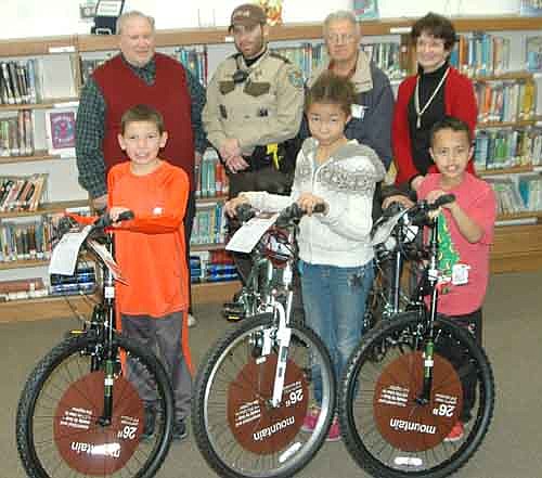 Three Central Intermediate School students have won bicycles courtesy of the Books for Bikes program sponsored by the Stewartville Masonic Lodge and the Olmsted County Deputy Sheriffs Association. The winners include, front row, from left, fourth grader Logan Plenge, fifth grader Jayla Berrio and third grader Jamal Aden. Back row, from left, William Hubbard of the Stewartville Masonic Lodge, Deputy Michael Reese of the Olmsted County Sheriff's Office, Len Griffith of the Masonic Lodge and Renita Irvin, media specialist for Stewartville schools.