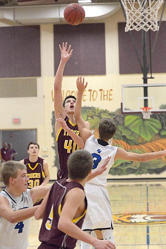 Carter Groski goes up and over a defender for a jumper in the paint.