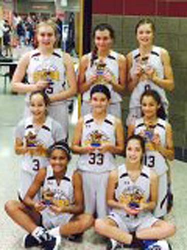 The SYBA 7th grade girls maroon traveling basketball team captured second place at the Inver Grove Heights basketball tournament held at Simley High School on Dec. 12-13. In first-round action, the Tigers beat Lakeville North 41-38. In the semifinals Stewie beat Inver Grove Heights 36-33 in overtime. In the championship game, the Tigers lost 37-34 to Rochester Lourdes. Team members are, seated, Hailey Lewis (left) and Olivia Otto. Kneeling, from left, Emily Otto, Mya Wangen, Maia Peterson. Standing, from left, Emma DeYoung, Jolie Stecher, Erin Lamb.