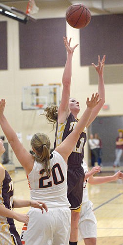 Libby Christenson beats a trailing defender and goes up and over one fronting her on this short jumper.