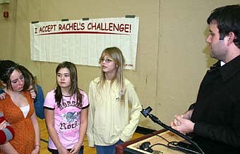 MESSAGE OF KINDNESS -- Cody Burch, a speaker representing "Rachel's Challenge," a program that motivates students to exhibit kindness and compassion, spoke with a number of Stewartville Middle School students after his presentation at the SHS gym last week, including, from left, Amy Hintz, Tiffany Simmons and Alyssa Bartel. 