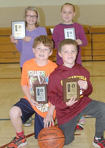 The winners of the annual Elks Hoop Shoot competition at Bonner Elementary School include, front row, from left, Kyle Carolan, second place for boys with 17 baskets in 25 attempts; and Nathan Nelson, first place, boys, 19 baskets in 25 attempts. Back row, from left, Haley Laures, first place for girls with 14 baskets in 25 attempts; and Kaylee Lehrman, second place, girls, 11 baskets in 25 attempts. The four will move on to regional competition, which will be held at the RCTC Field House on Sunday, Jan. 10 at 11 a.m. All the students are third graders.