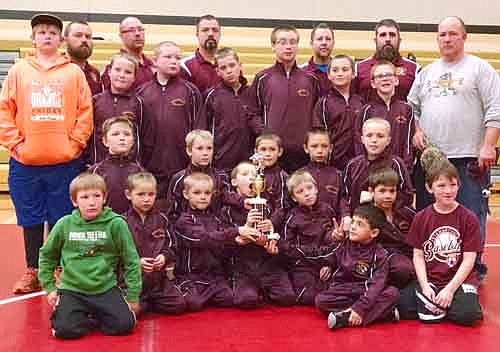 The Stewartville youth wrestling team poses with its trophy after capturing third place at the Caledonia Team Duals on Dec. 19.