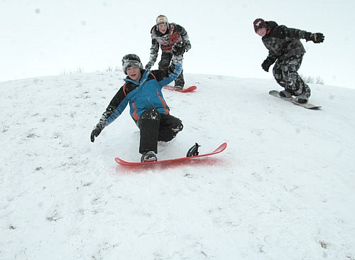 Three Central Intermediate School students had fun snowboarding on the hill at Meadow Park North after a winter storm dumped about seven inches of snow on Stewartville and the area on Monday, Dec. 28 and Tuesday, Dec. 29. From left are Ben Hagen, 11, of Stewartville, a fifth grader; Tanner Elzen, 9, of Stewartville, a fourth grader, and Jake Halferty, 11, also of Stewartville, a fifth grader.