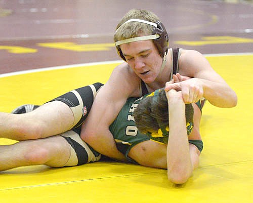 Joey Thompson turns the hips, pulls back on the wrist and drives the shoulders of his 120-pound Mayo opponent to the mat before pinning him. Thompson finished first in the 120-pound weight class at the Stewie Invite.