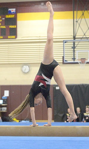 Emilee Otto executes a cartwheel during her beam routine against Byron.